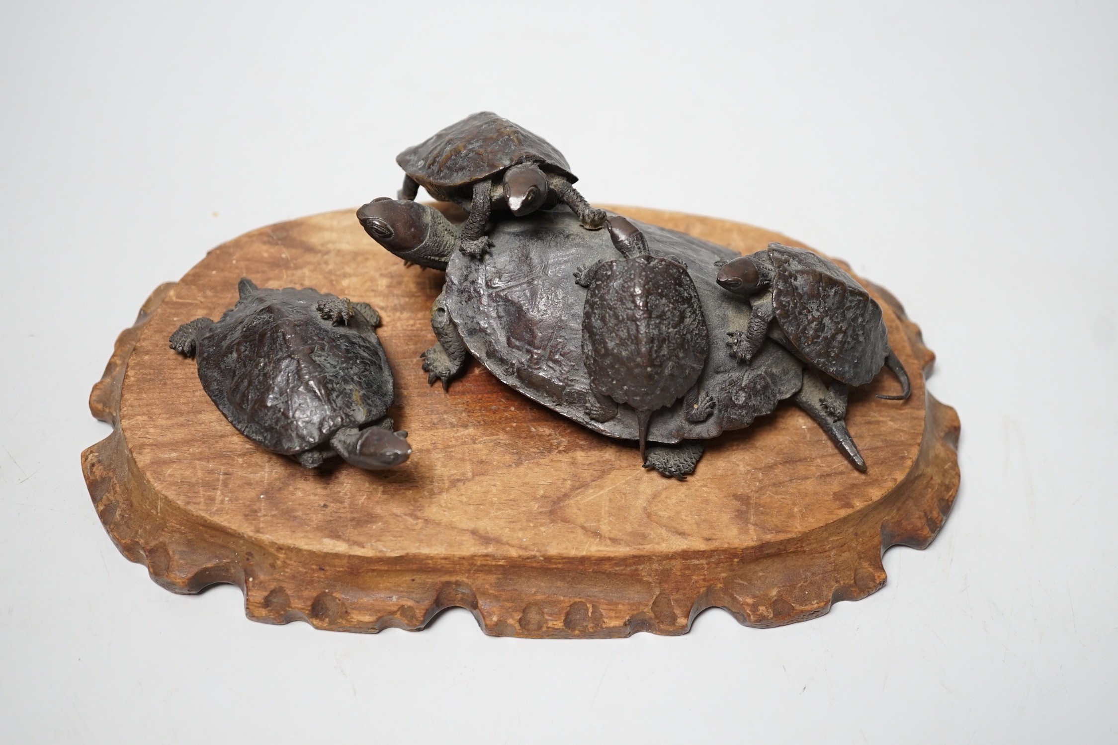 A Japanese Meiji period bronze turtle group, signed to base, (a.f.), 16cm wide